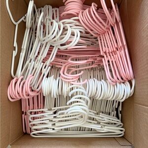 Pink and White Plastic Hangers